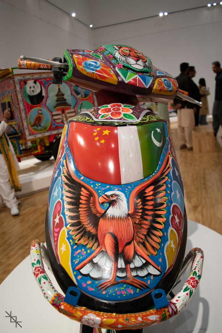 A scooter decorated with truck art and the Chinese and Pakistani flag showing the solidarity between the iron brothers.